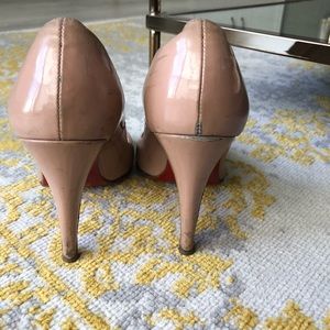 Nude Christian Louboutin peep toe heels